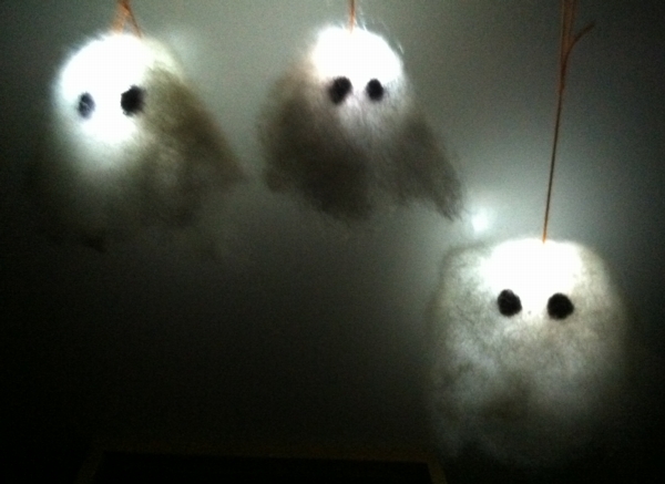 Three needlefelted ghosts, glowing